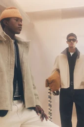 Two male models in neutral jackets posing in a minimalist indoor space for Zara Edition Collection