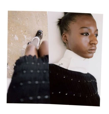 Model wearing a black textured top and white collar in a Diotima Fall/Winter 25 fashion editorial photograph.