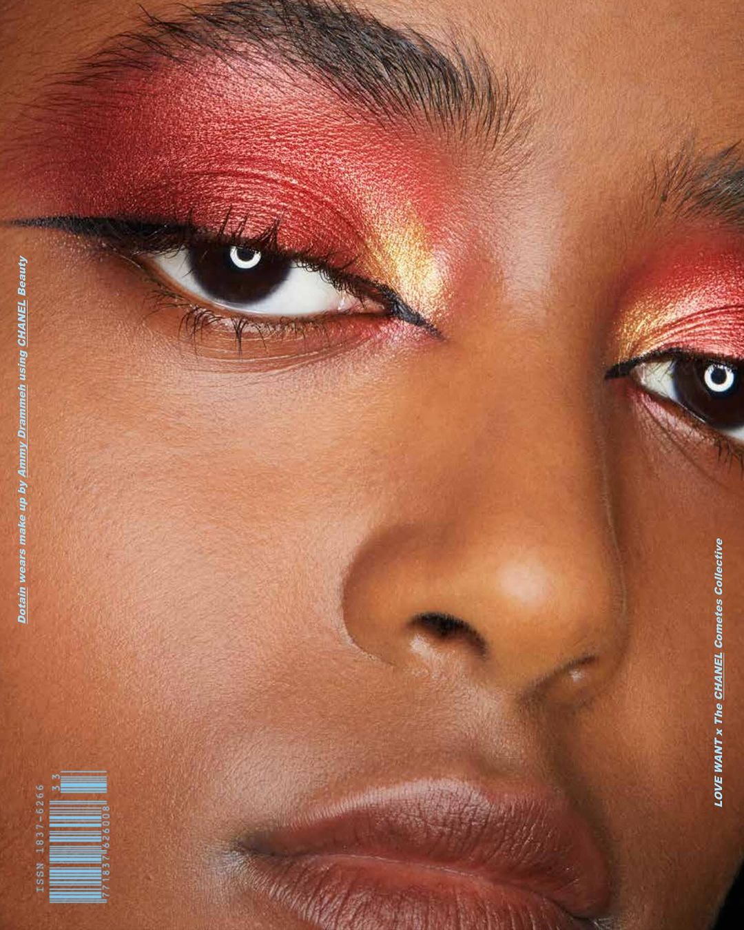 Close-up portrait of a woman with vibrant red and gold eyeshadow and winged eyeliner for The Chanel Cometes Collective
