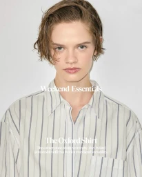 Model Lila Pankova wearing a striped Oxford cotton shirt against a plain white studio background for Max Mara.