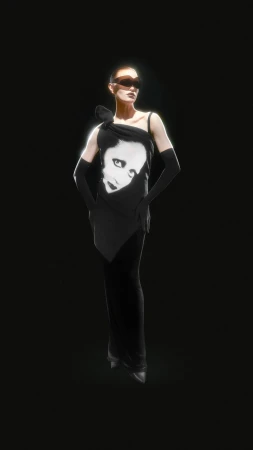 Fashion shot of woman in black dress with face graphic, wearing sunglasses and long gloves, against a black backdrop with soft lighting.
