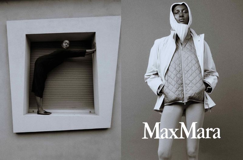 Black and white fashion shot: Two women, one framed in window, the other in modern clothing. Max Mara logo is present.