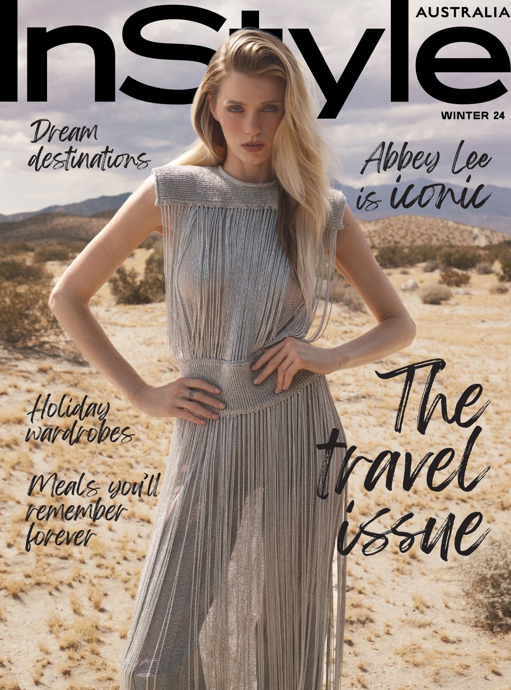 Magazine cover featuring Abbey Lee in a shimmering fringe dress, set against a desert backdrop. Text includes 'InStyle' and 'The travel issue'.