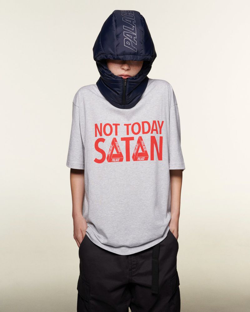 Person wearing a grey 'Not Today Satan' t-shirt with a dark blue Palace hood on a neutral background in a studio shot.