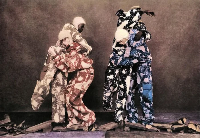 Group of models in patterned outerwear embracing against a textured mottled backdrop by Pronounce