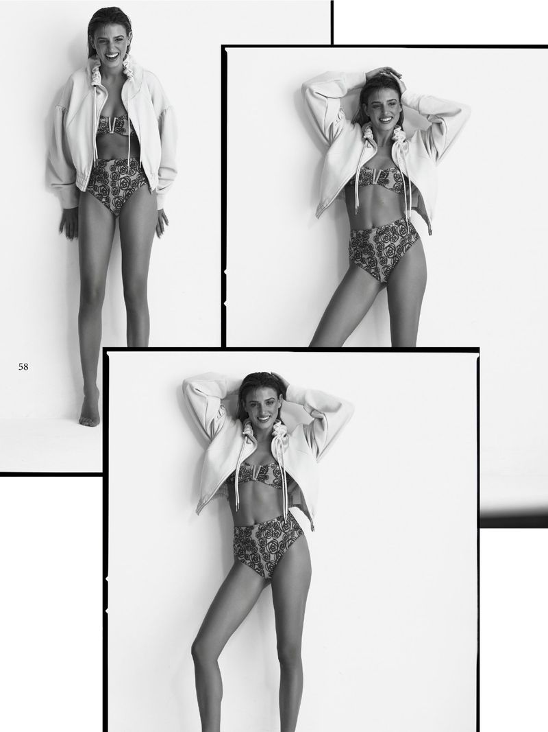 Monochrome fashion lookbook spread featuring a smiling female model wearing a light zip jacket and patterned high-waist swimwear.