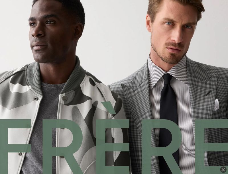 Two adult men pose in fashionable jackets, one camo, one grey plaid, against a plain background. Text overlay reads FRERE.