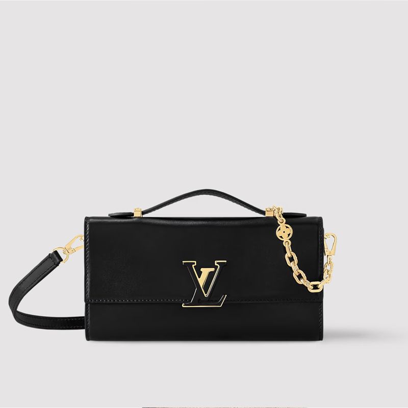 Studio shot of a black leather Louis Vuitton bag with a gold LV logo, chain strap, and handle against a neutral background.