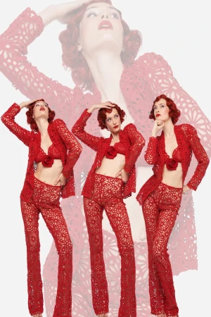 Multiple exposures of a redhead woman wearing a red lace pant suit, standing in various poses against a white backdrop in a studio.