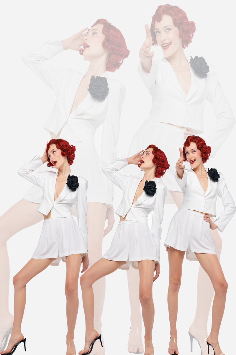 Multiple exposures showcase a redhead model in a white suit against a white background. She poses dynamically, expressing a playful attitude.
