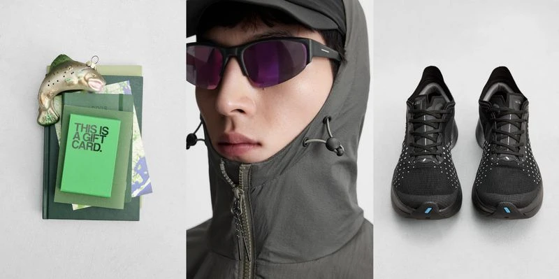 Still life of an Asian male model wearing sunglasses and hooded jacket next to running shoes, an ornament, and books with a gift card.