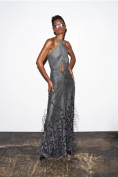 Model Ysaunny Brito wearing a grey halter gown and sunglasses for LaPointe Pre-Fall 2025 lookbook against a white backdrop
