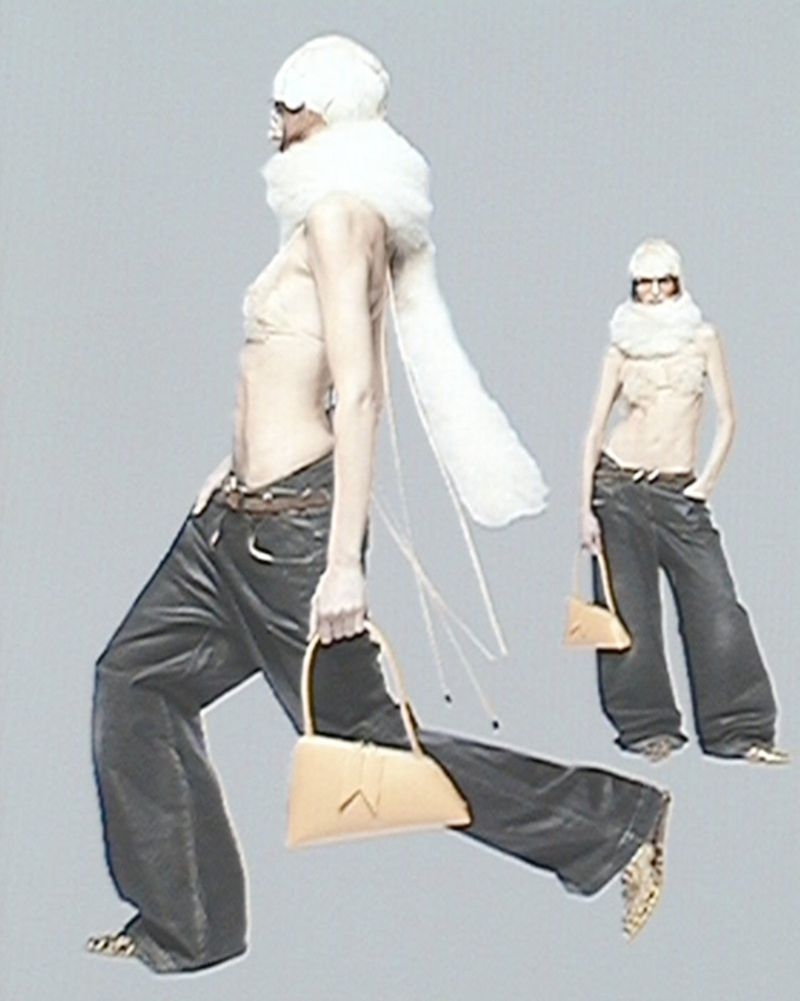 Fashion shot of a woman with a light skin tone wearing a beige top, dark pants, and holding a purse, with another blurred figure behind her.