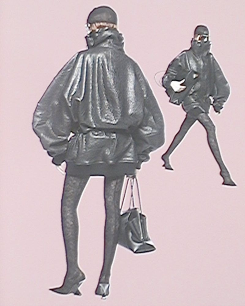 Two women wearing black shiny leather jackets, skirts, berets, and patterned stockings strike fashion poses against a pink background.