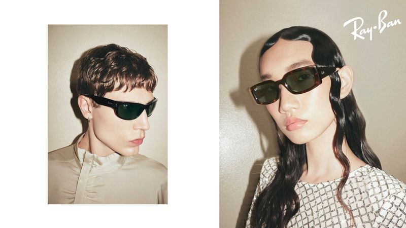 Two models showcase Ray-Ban sunglasses in a split portrait composition with a neutral color palette and brand logo visibility.