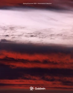 Dramatic layered sunset sky with dark crimson and black clouds beneath a pale band, featuring Goldwin branding.
