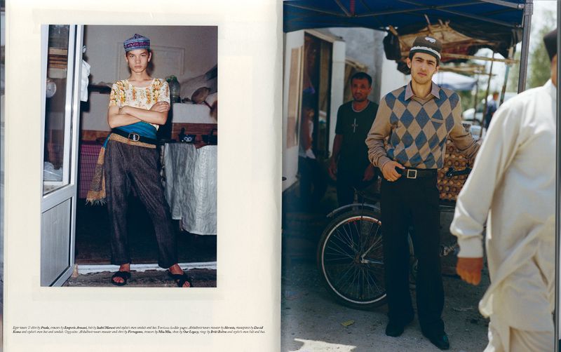 Two men model traditional Central Asian clothing in an indoor-outdoor setting, featuring vibrant textiles, natural light, and cultural elements.