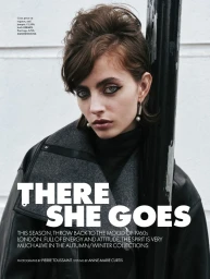 Model Patrycja Piekarska with dark eyeliner wearing a leather jacket and turtleneck leaning against a post for Elle UK