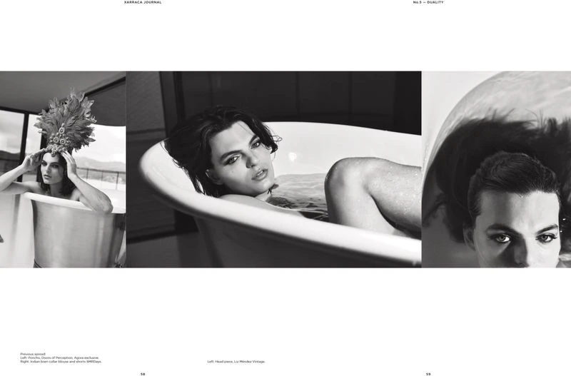 Black-and-white fashion editorial featuring a young adult in a bathtub wearing a feather headdress, conveying a vintage aesthetic.