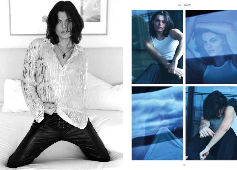 Black-and-white portrait of a person on a bed, styled in a semi-sheer shirt and black pants, alongside magazine layout with blue-toned photos.