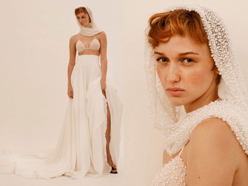 A red-haired woman in a white skirt and beaded top and head covering poses in a studio setting, with a crop showing her facial details.
