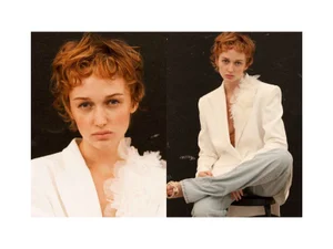 Diptyque fashion editorial image featuring a red-haired model in a white blazer and light jeans against a dark background.