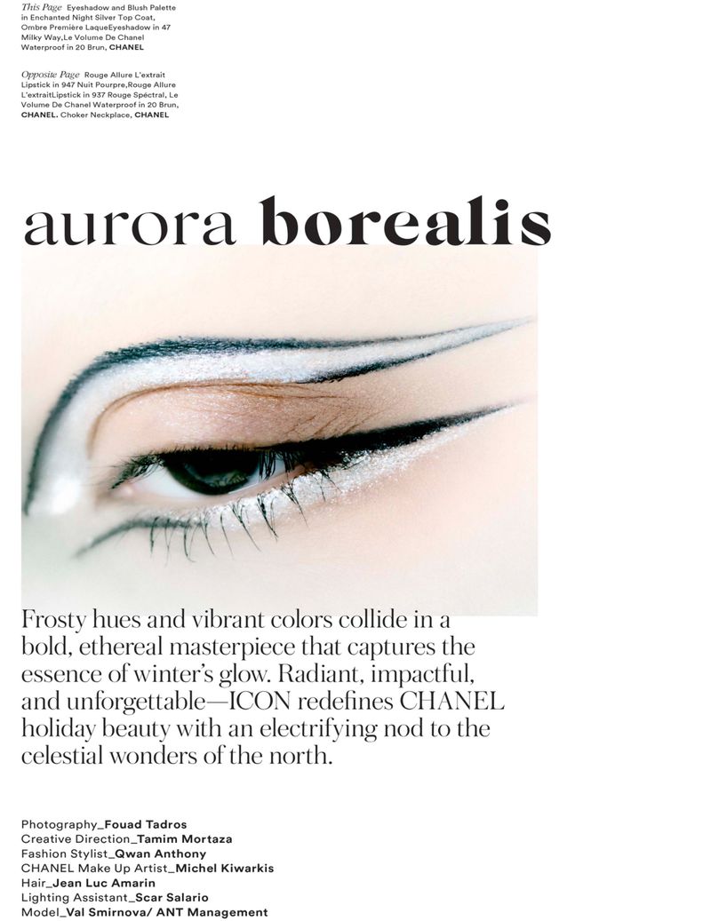 Close-up studio shot of a woman's eye featuring white and black graphic eyeliner, set against a clean, minimalist white backdrop.