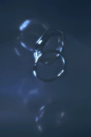 Abstract image of shiny, interlocked rings on a dark blue background with light reflections and highlights, creating a modern aesthetic.