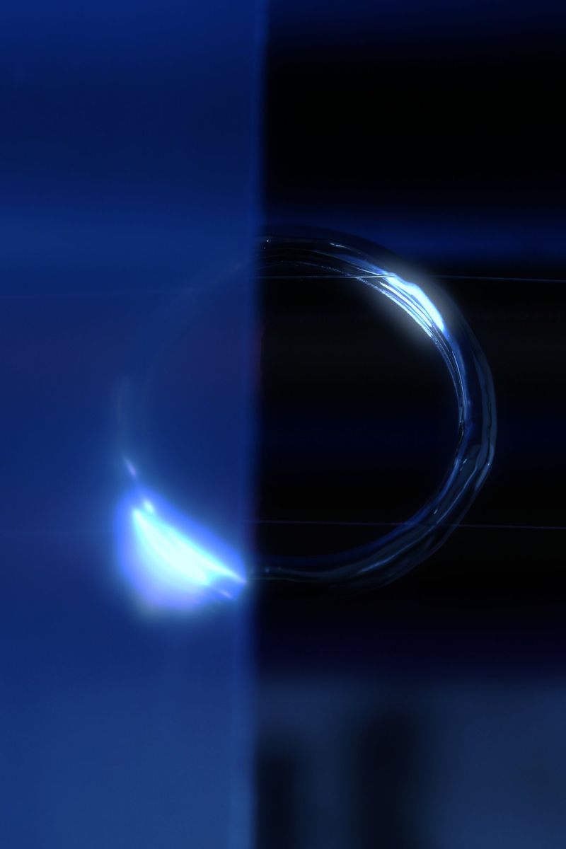 Abstract image featuring a luminous ring with a blend of dark blue and black, creating a captivating visual effect. AI generated.