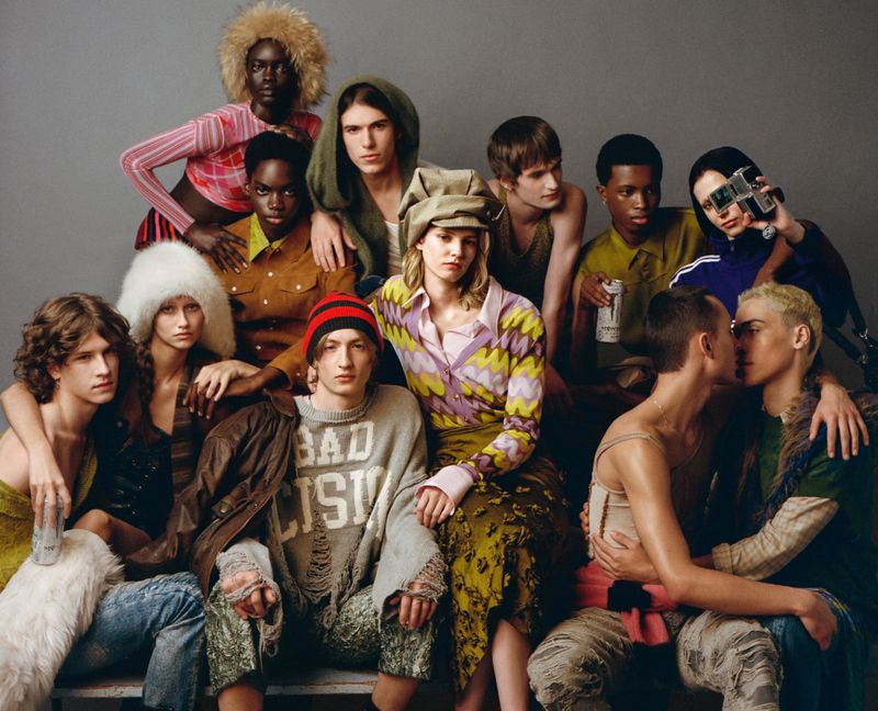 Group portrait of diverse young adult fashion models posing together in colorful clothing, studio setting, capturing a dynamic editorial aesthetic.
