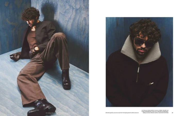 Two images of a male model wearing a brown jacket and trousers, sunglasses, and black boots set against a blue wood-paneled backdrop.