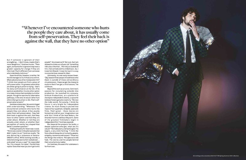 Editorial fashion shot of a stylish adult man in a green-and-black checkered suit with silver foil on the shoulder, indoors.