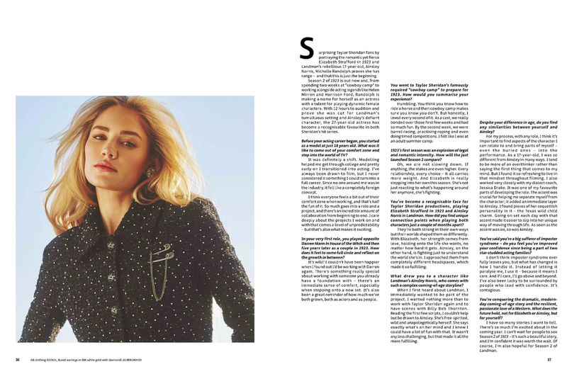 Blonde woman in tweed jacket poses in a medium shot, with shoulder-length hair, soft makeup, and natural lighting.