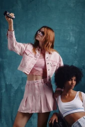 Two models posing against a textured blue backdrop for HUGO Blue Summer 2025 Lookbook, photographed by William Arcand
