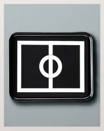 Black rectangular lacquer tray featuring a bold white geometric logo motif centered on a smooth grey surface.