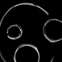 Polished silver jewellery and sculptural metal rings arranged on a solid black background.