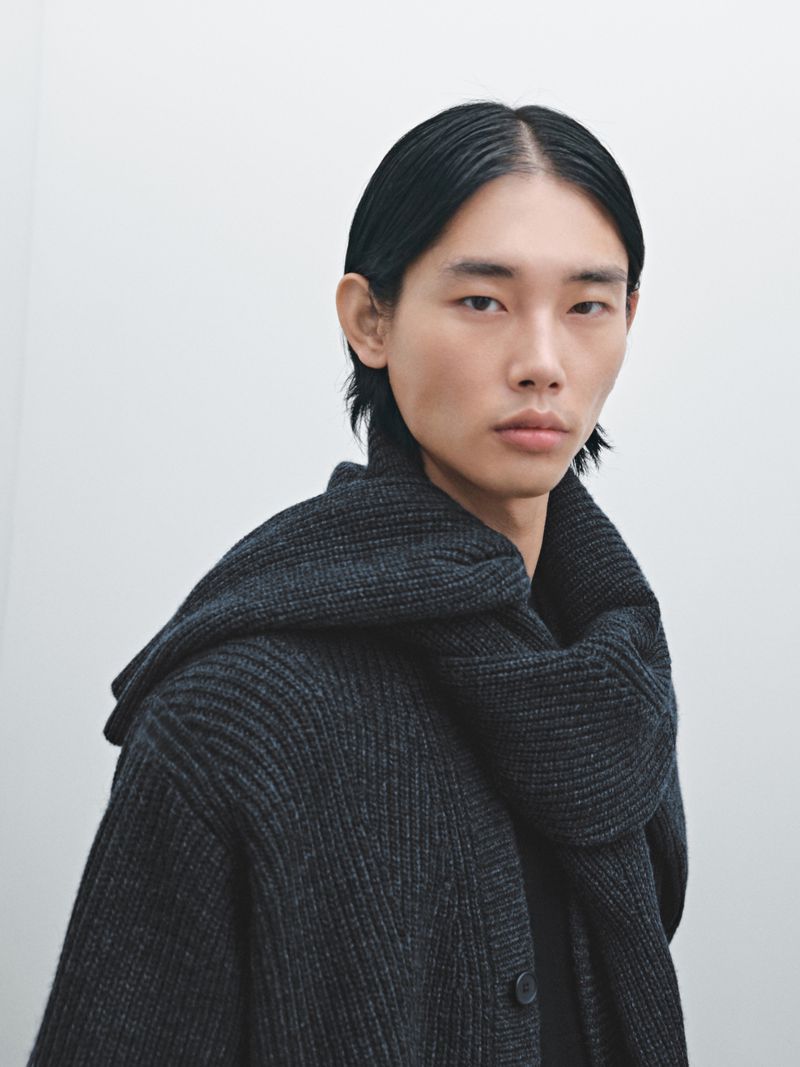 Taemin Park wearing a charcoal ribbed knit cardigan and matching scarf against a pale studio background for Massimo Dutti.