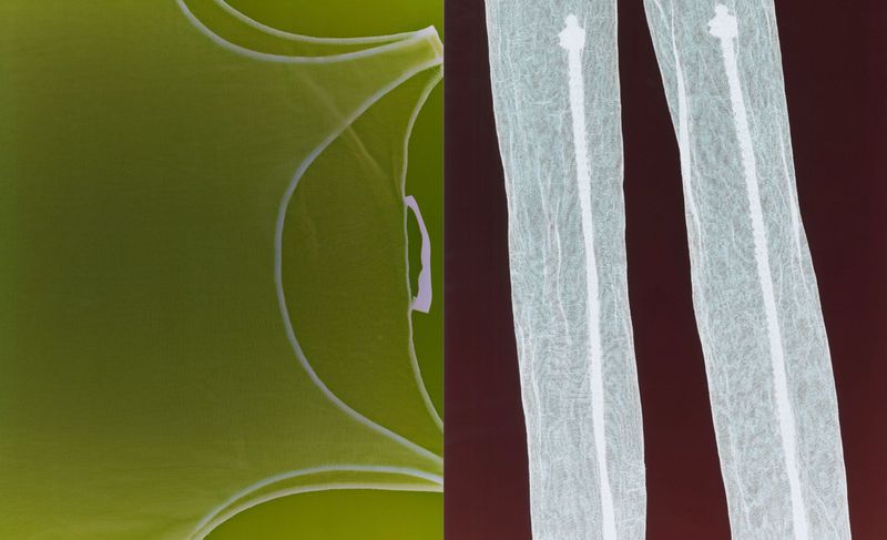 Split-frame abstract featuring a section of light green fabric and light grey medical swabs over a dark red background.