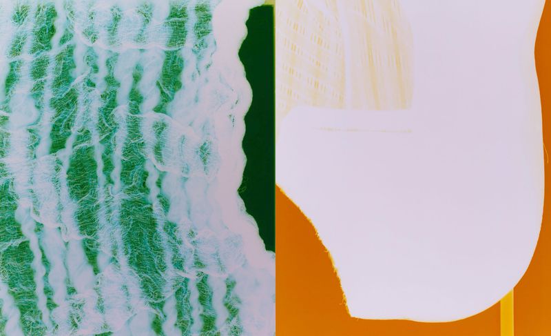 Abstract still life with light green gauze and an abstract white form set against green and orange backgrounds, close-up.