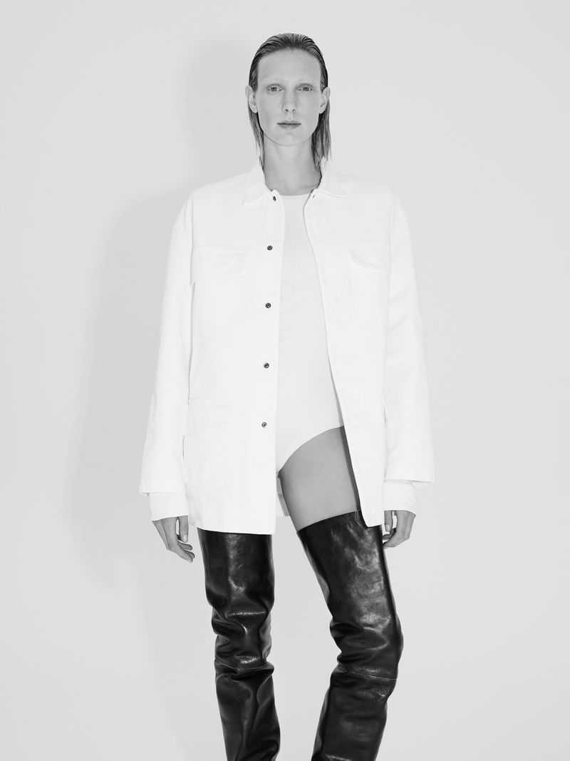Model Annely Bouma in white shirt and black leather boots against a white studio background for ADELBEL SS25.