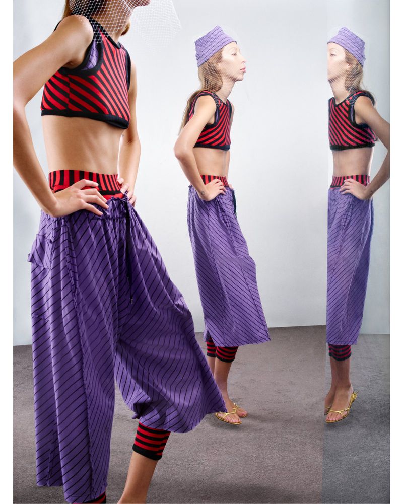 Three images of a female fashion model in a red and black striped crop top and purple striped pants against a bright white background.