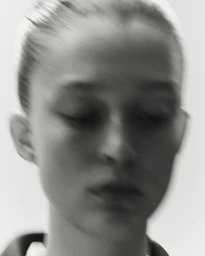Monochrome close-up portrait of model Stinne Trappeniers with motion blur for Ashlyn S/S25 lookbook.