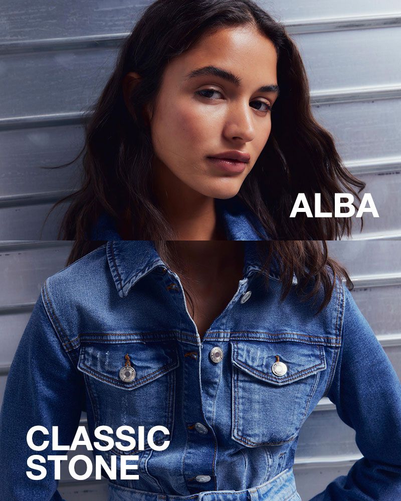 Close-up fashion shot featuring an adult female with dark hair and a blue denim jacket in a vertically-oriented composition.