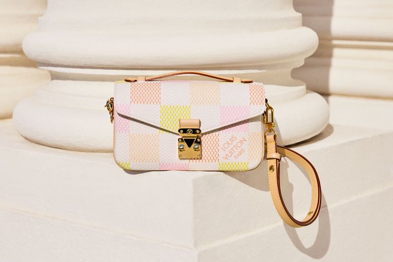 Luxury Louis Vuitton handbag with a pastel checkerboard pattern, gold hardware, leather handle and strap, and a modern aesthetic.