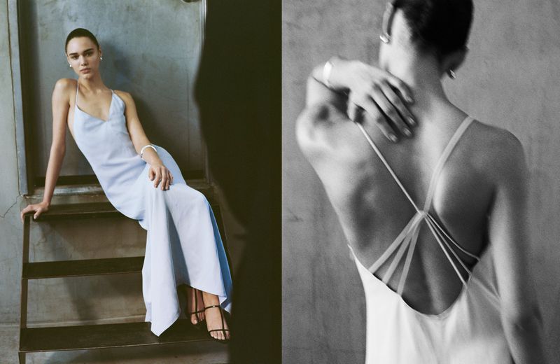 Fashion photo of a young woman posing on steps in a light blue dress, another image shows the back of the dress. Studio setting.