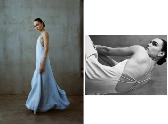 Model Mily Reuter posing in a light blue maxi dress against a textured grey wall for Moda Operandi x TWP PF24 campaign.