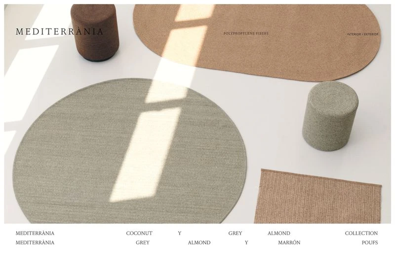 Minimalist product shot featuring area rugs and cylindrical poufs in neutral tones on a clean white surface with natural lighting.