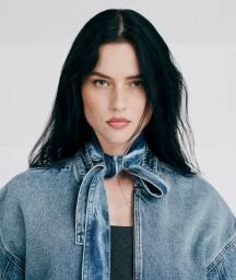 Model Isis Bataglia wearing a denim jacket with a matching neck tie for C and A Jeans 2024 photographed by Hick Duarte.
