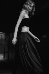 Model Felice Nova Noordhoff in a dark strapless top and long skirt for COS Summer Newness editorial campaign.