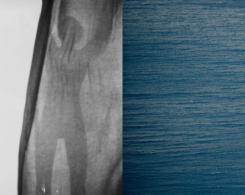 Abstract monochrome image featuring rippled ocean water and a grey human silhouette-like shape with a draped fabric texture.